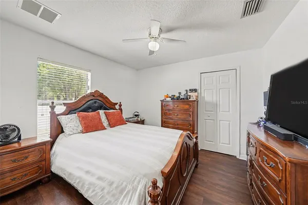 a view of a house with swimming pool and sitting area