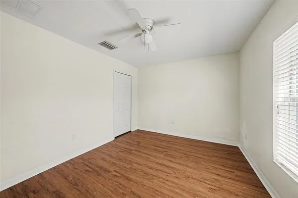 a view of a house with a swimming pool and a fire pit