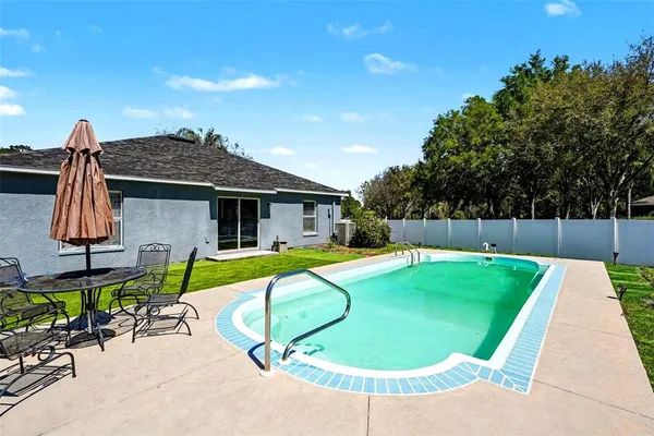 an aerial view of a house with a garden