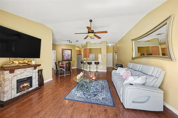 a view of a dining room with furniture and wooden floor