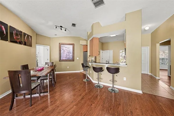 a kitchen with granite countertop a sink and a stove top oven