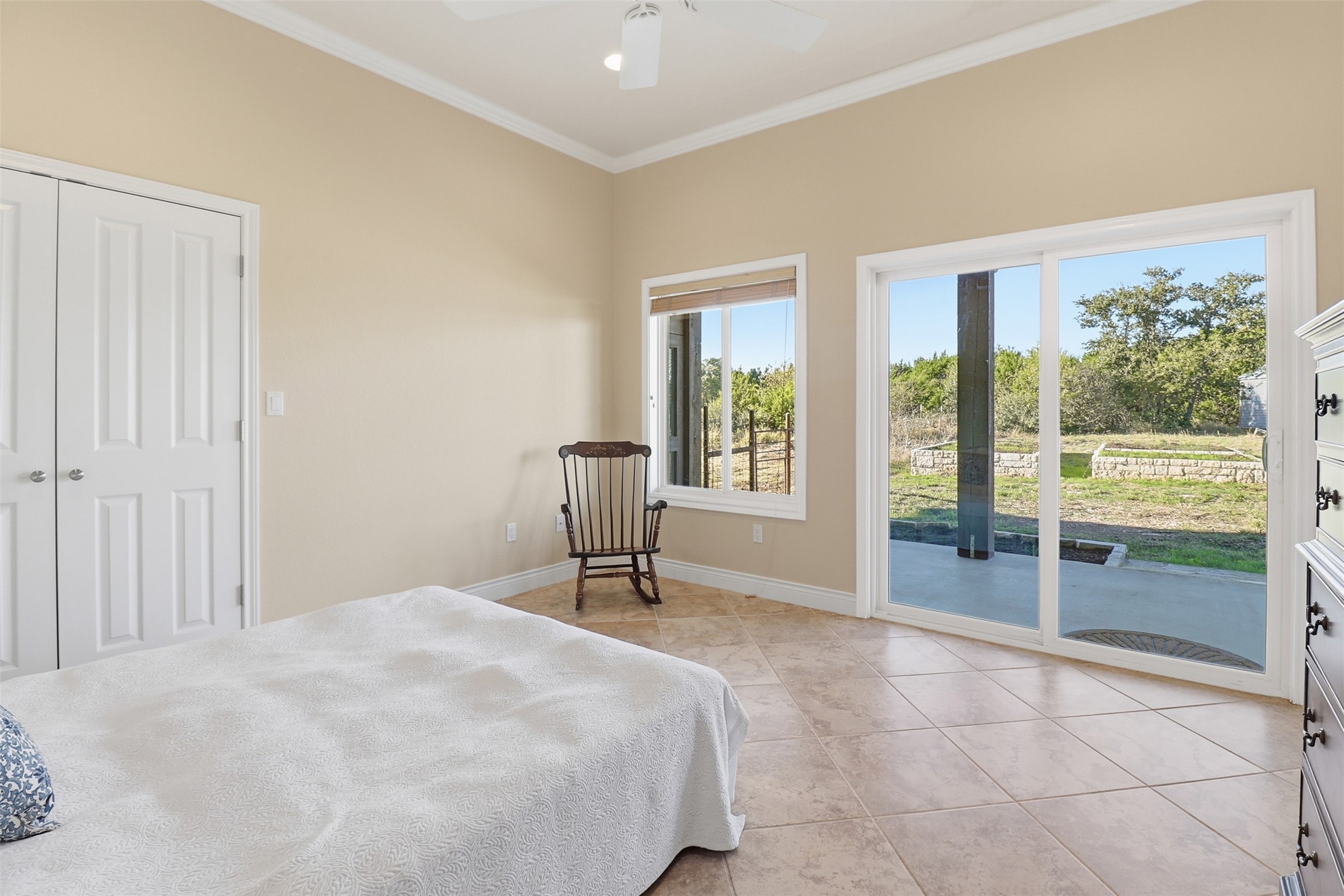 450 Threadgill Ranch Road Burnet, TX 78611 - Photo 14 of 33 a bedroom with a bed and a table in it