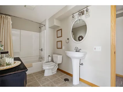 a bathroom with a sink a mirror and a toilet