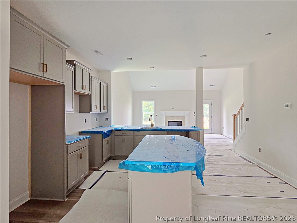 2678 Norrington Road Lillington, NC 27546 - Photo 6 of 31 a large kitchen with cabinets and stainless steel appliances