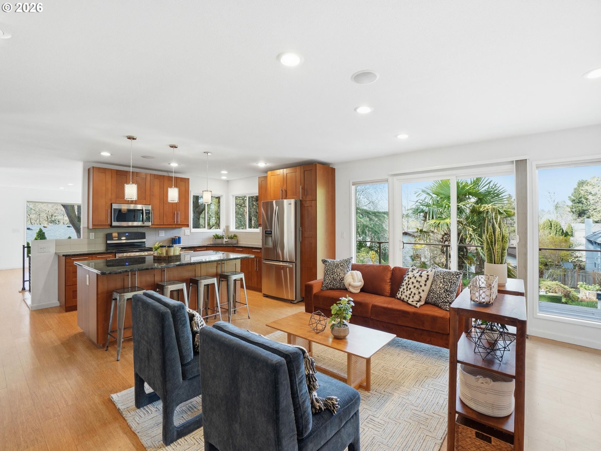4148 Southwest 43rd Avenue Portland, OR 97221 - Photo 15 of 44 a living room with furniture a large window and a dining table