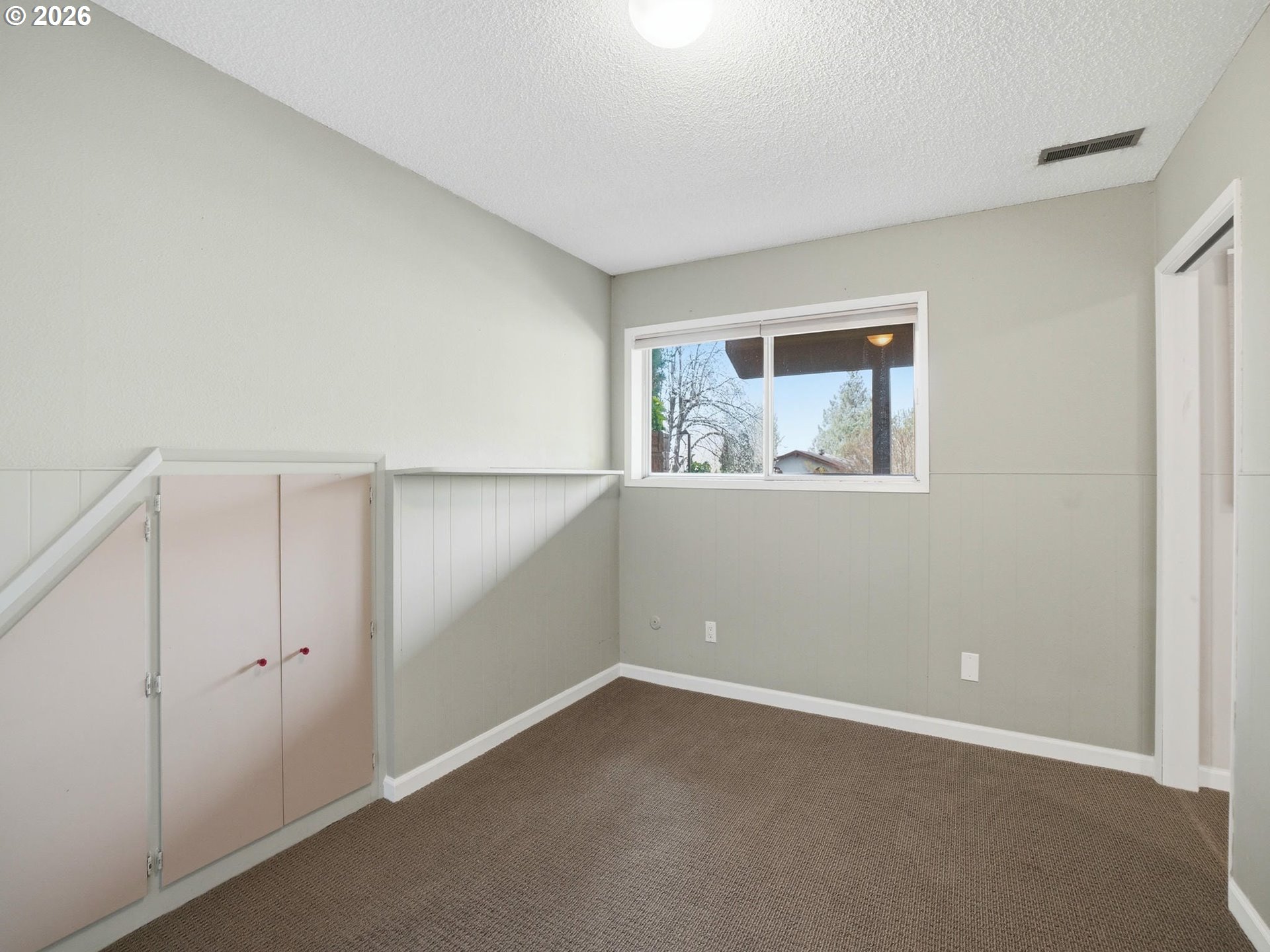 4148 Southwest 43rd Avenue Portland, OR 97221 - Photo 26 of 44 a view of an empty room with a window