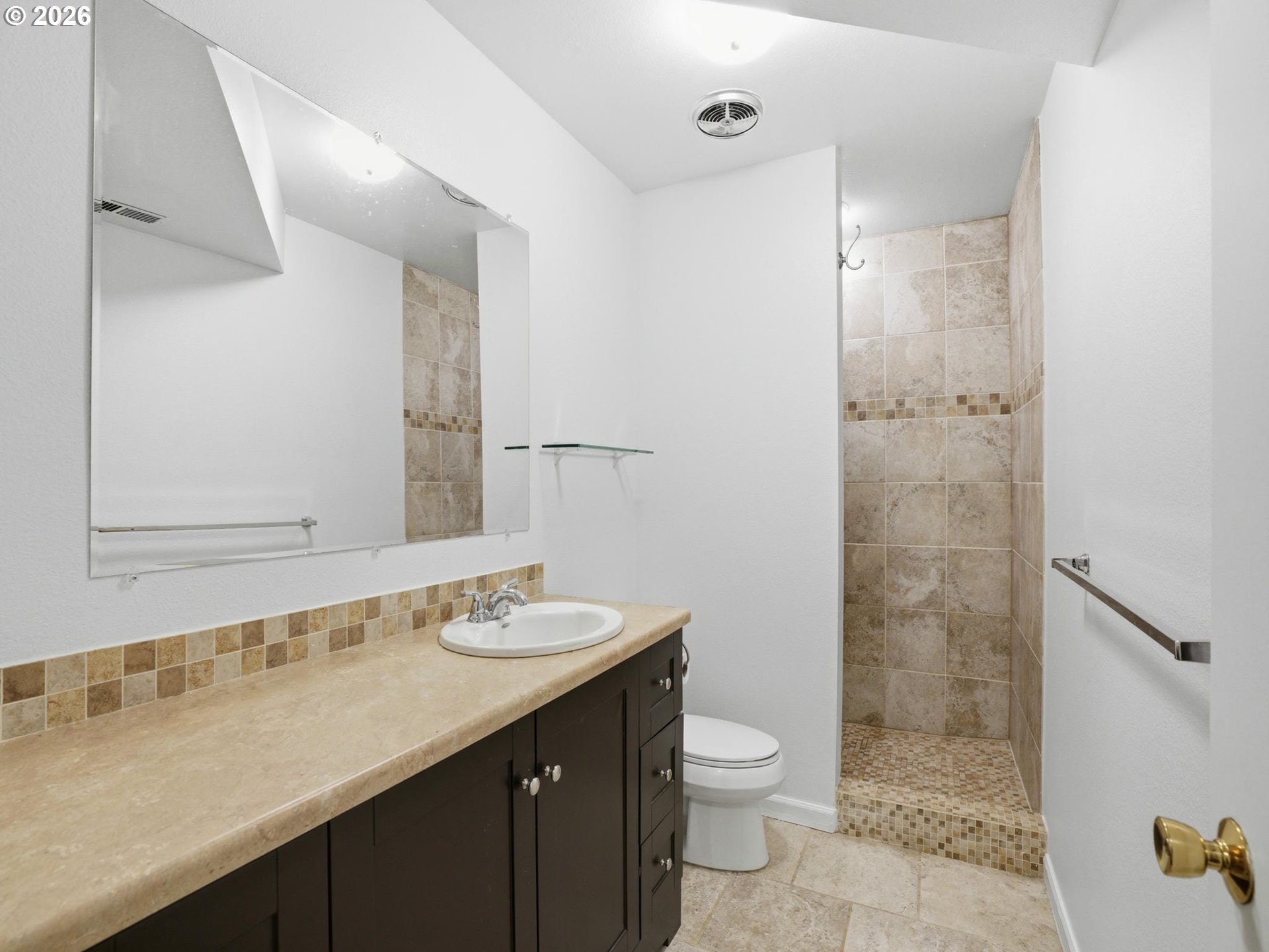 4148 Southwest 43rd Avenue Portland, OR 97221 - Photo 28 of 44 a bathroom with a sink a toilet and shower