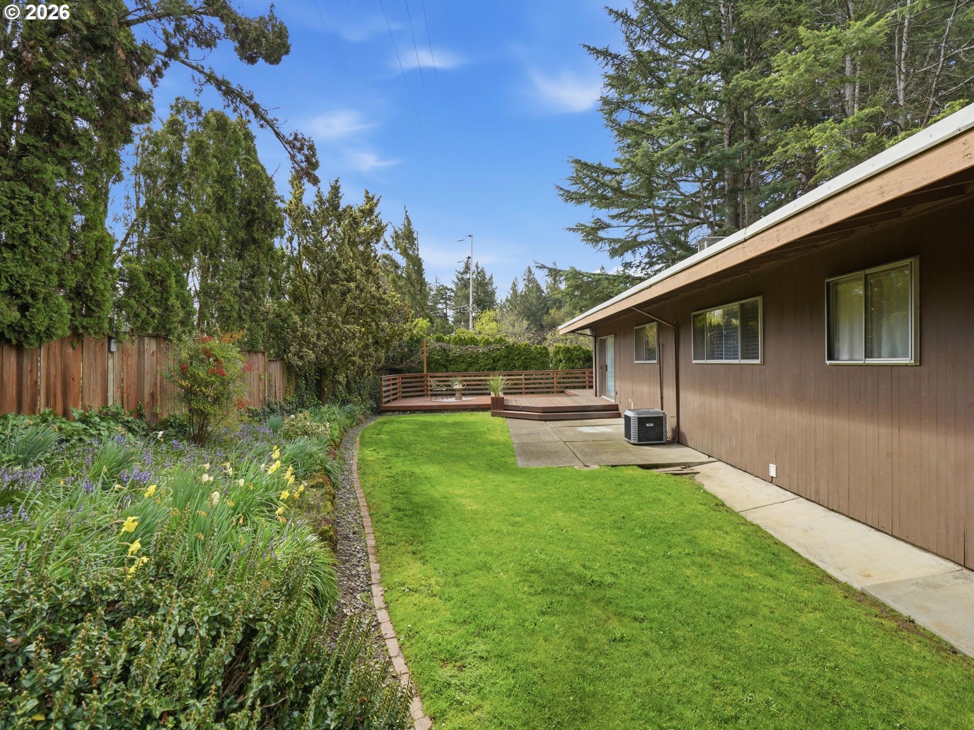 4148 Southwest 43rd Avenue Portland, OR 97221 - Photo 33 of 44 a backyard of a house with lots of green space