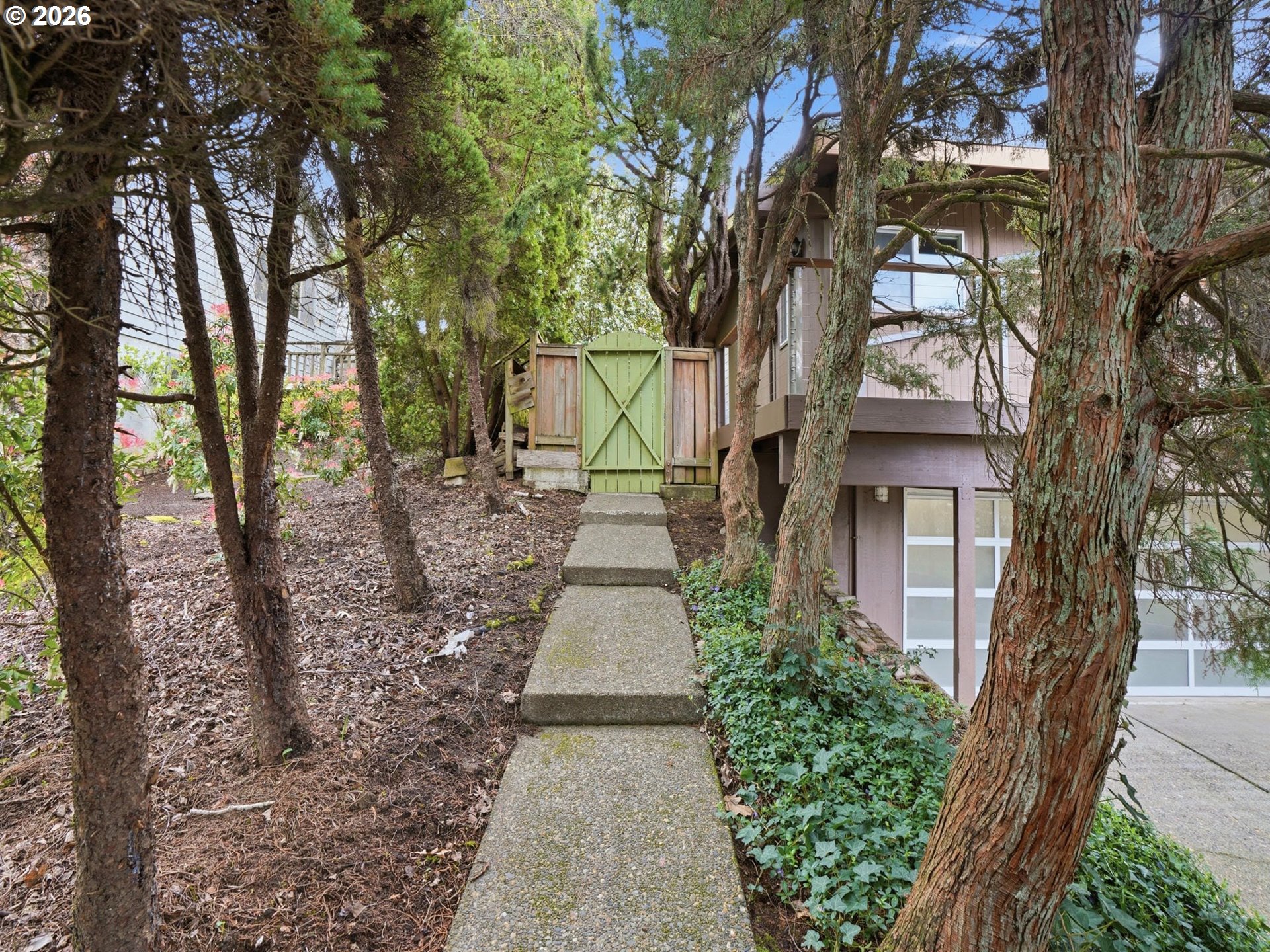 4148 Southwest 43rd Avenue Portland, OR 97221 - Photo 36 of 44 a view of a pathway with a tree in the background
