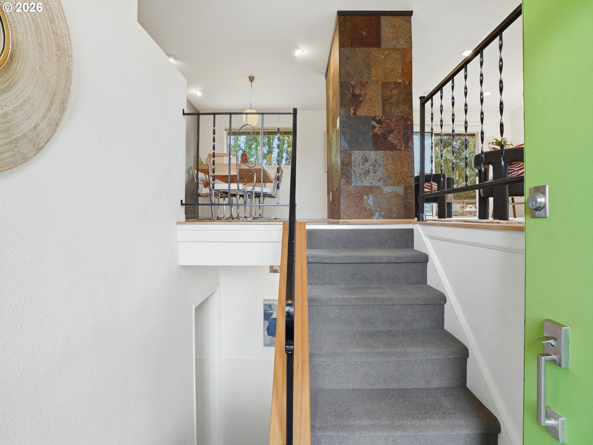 4148 Southwest 43rd Avenue Portland, OR 97221 - Photo 4 of 44 a view of staircase with white walls and a potted plant