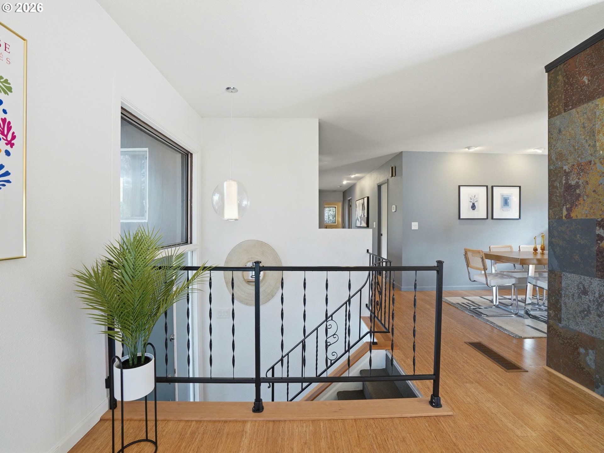 4148 Southwest 43rd Avenue Portland, OR 97221 - Photo 9 of 44 a view of staircase with wooden floor and a potted plant