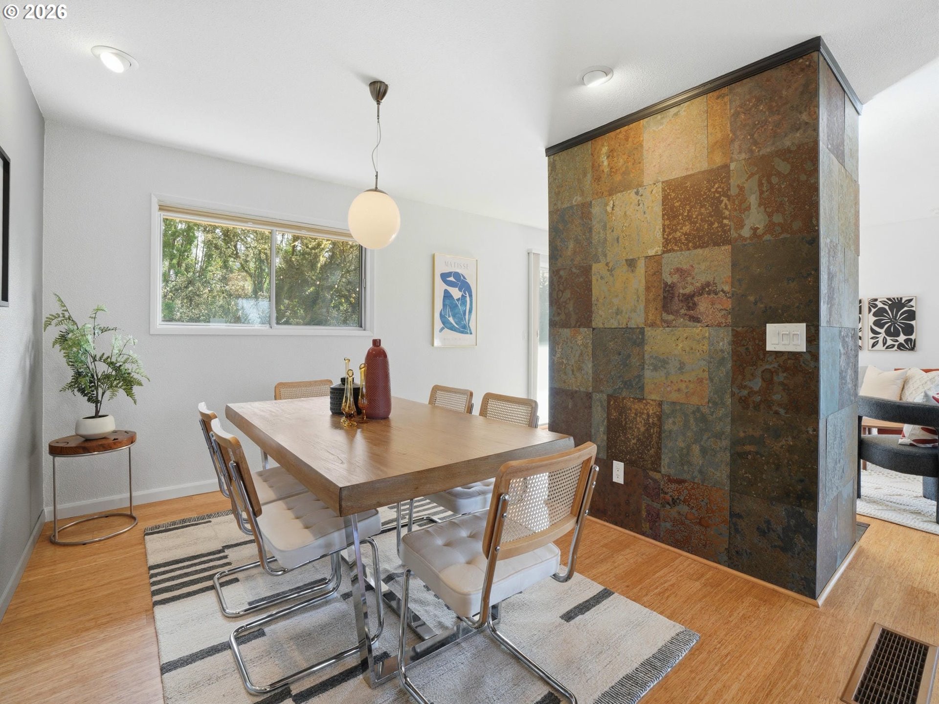 4148 Southwest 43rd Avenue Portland, OR 97221 - Photo 10 of 44 a view of a dining room with furniture window and wooden floor
