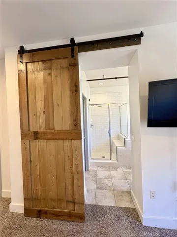 a view of a bathroom with a glass door