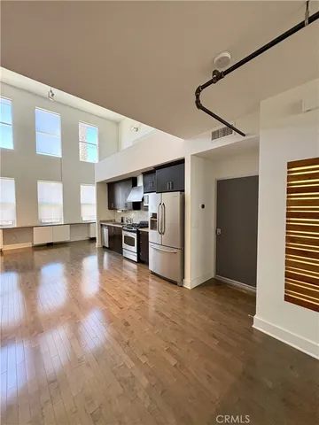 a view of kitchen with furniture and wooden floor