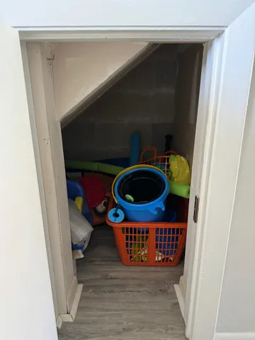 a living room with washer and dryer