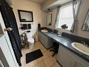 a bedroom with a bed and cabinets