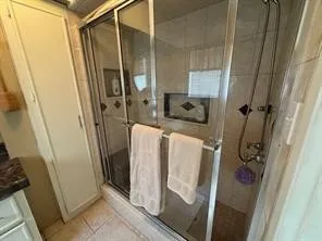 a bedroom with a bed and a mirror