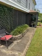 a patio with table and chairs