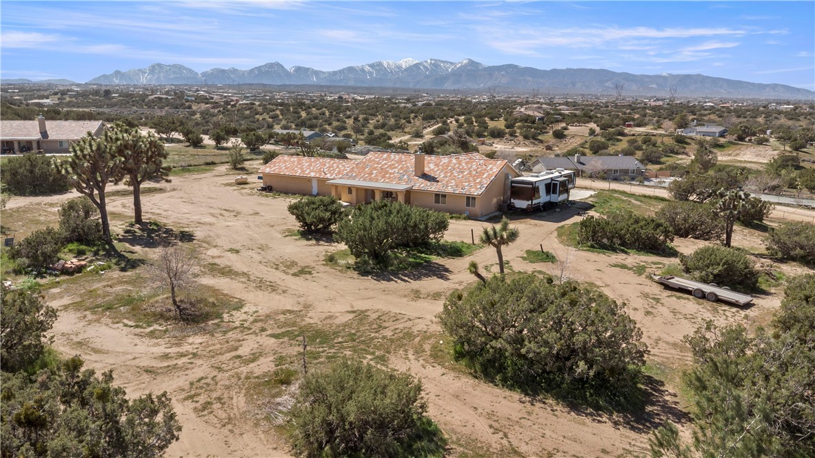 8755 Lilac Road Oak Hills, CA 92344 - Photo 2 of 28 a view of a city with mountains in the background