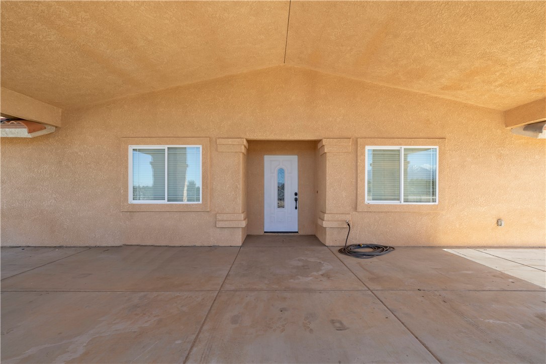 8755 Lilac Road Oak Hills, CA 92344 - Photo 25 of 28 a view of an empty room with windows