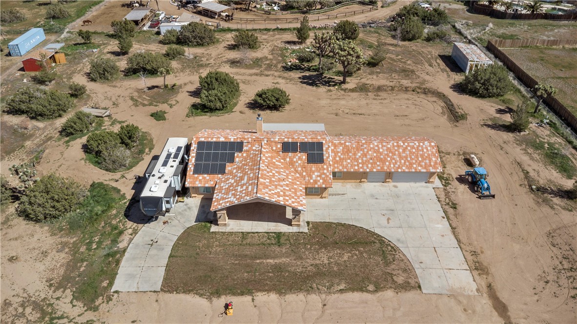 8755 Lilac Road Oak Hills, CA 92344 - Photo 26 of 28 an aerial view of a house with a yard