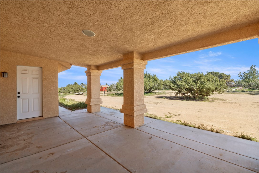 8755 Lilac Road Oak Hills, CA 92344 - Photo 28 of 28 a view of a room next to a yard