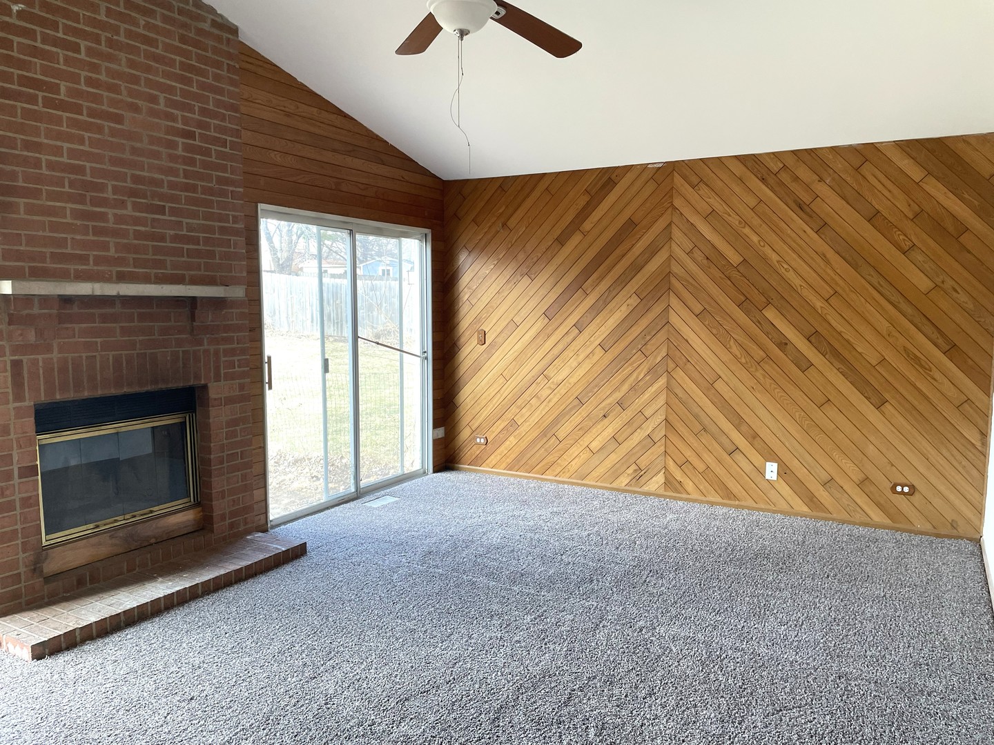 1740 Cumberland Road Aurora, IL 60504 - Photo 16 of 37 a view of an empty room with a fireplace and a window