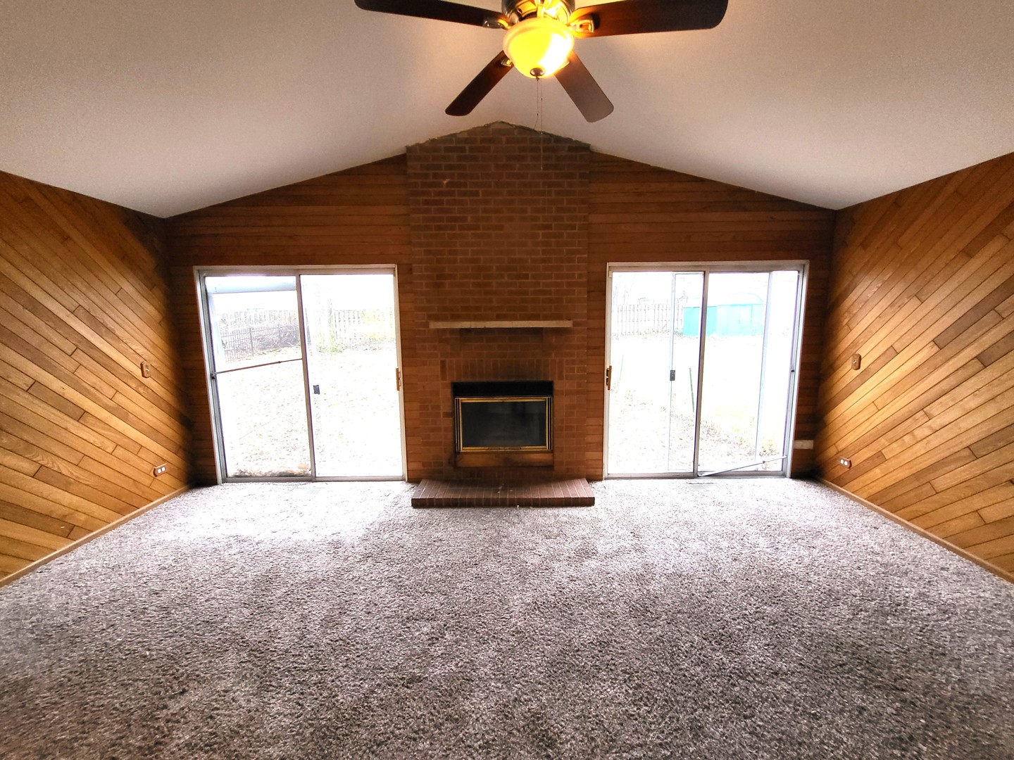 1740 Cumberland Road Aurora, IL 60504 - Photo 18 of 37 a view of empty room with a fireplace and fan