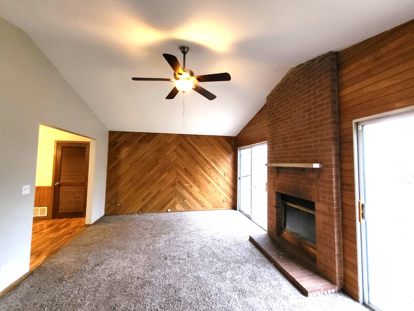 1740 Cumberland Road Aurora, IL 60504 - Photo 20 of 37 a view of a livingroom with a fireplace and a ceiling fan