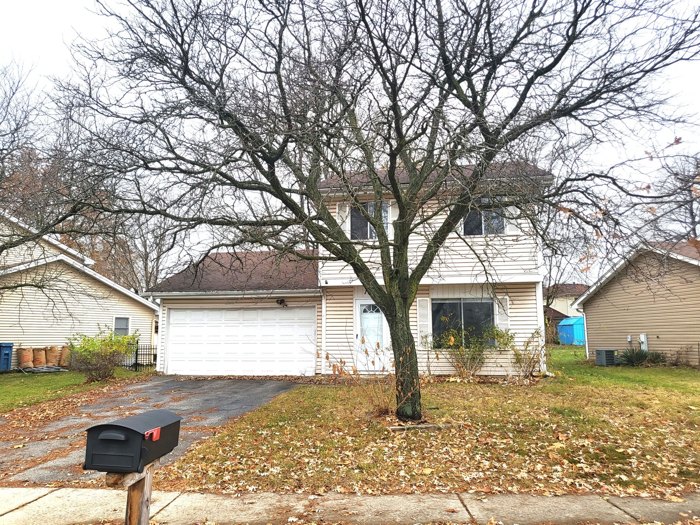 1740 Cumberland Road Aurora, IL 60504 - Photo 2 of 37 a view of a yard with a large tree
