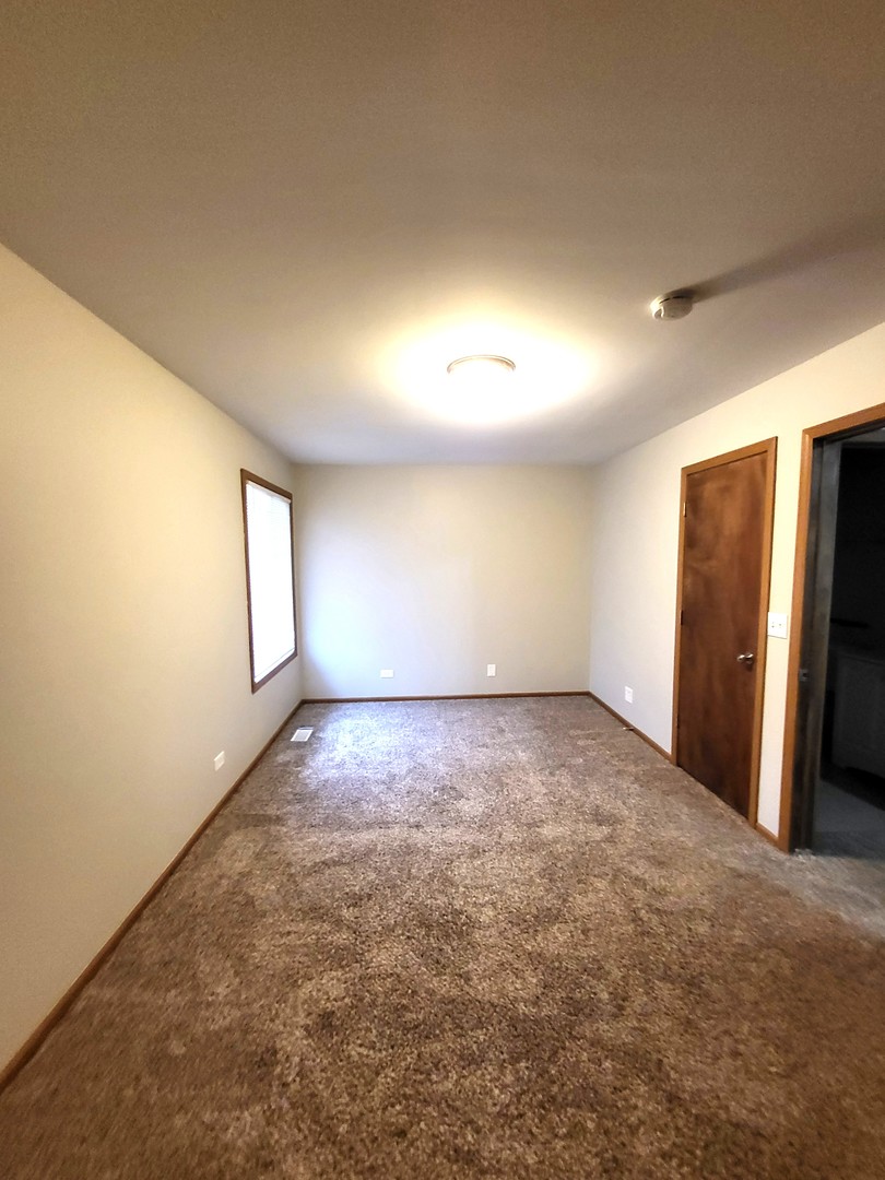 1740 Cumberland Road Aurora, IL 60504 - Photo 25 of 37 a view of an empty room and a window