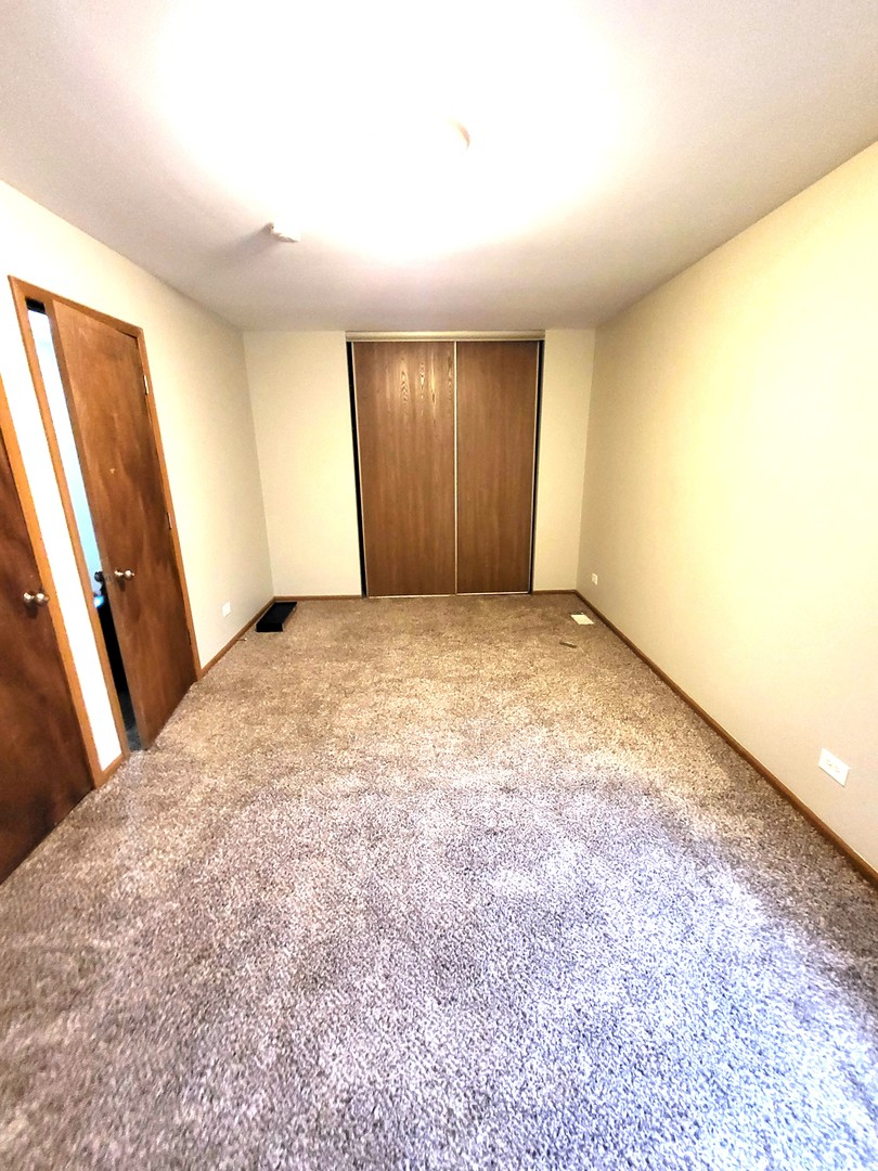 1740 Cumberland Road Aurora, IL 60504 - Photo 27 of 37 a view of an empty room and a window