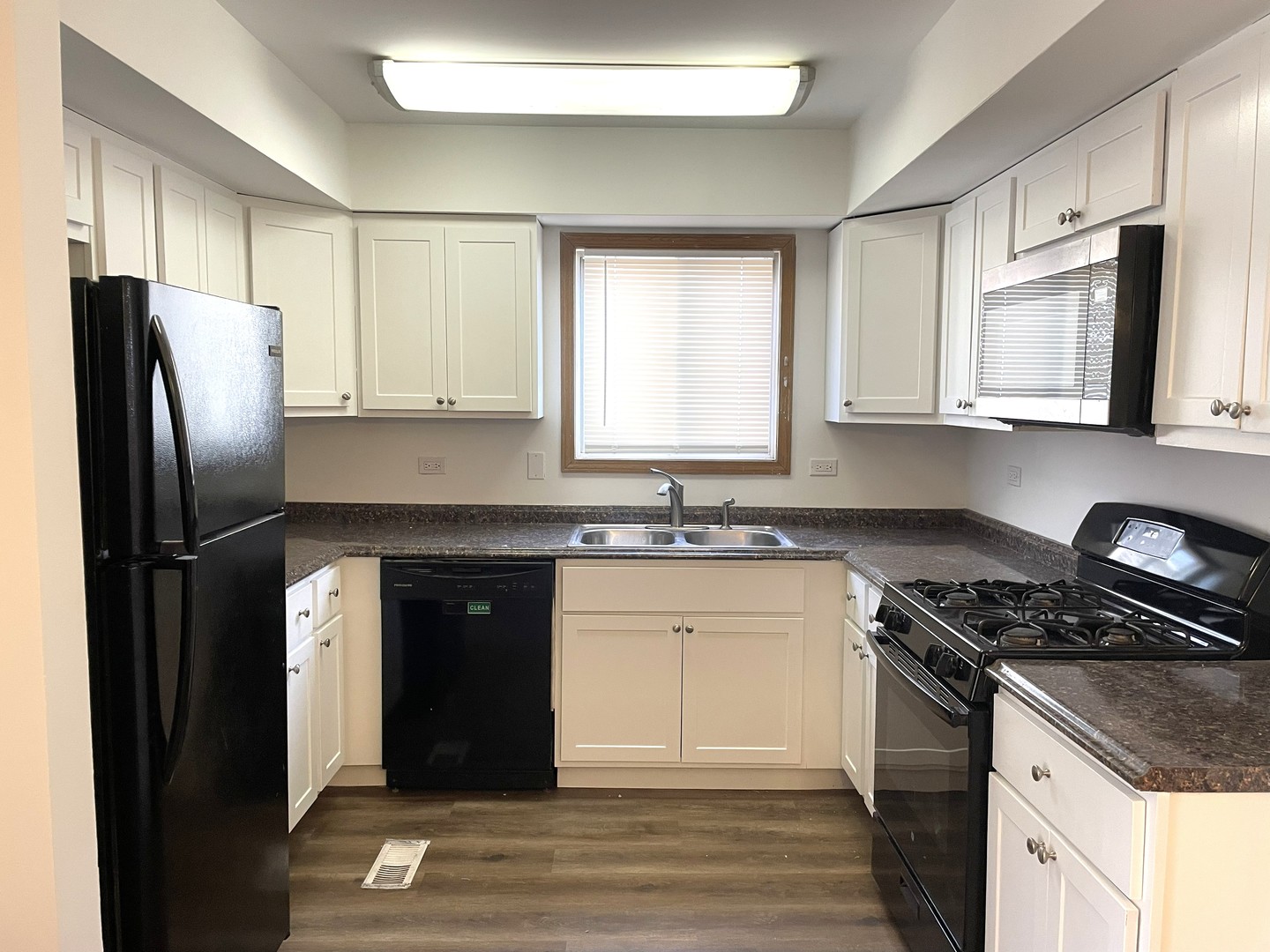1740 Cumberland Road Aurora, IL 60504 - Photo 6 of 37 a kitchen with a refrigerator stove and sink