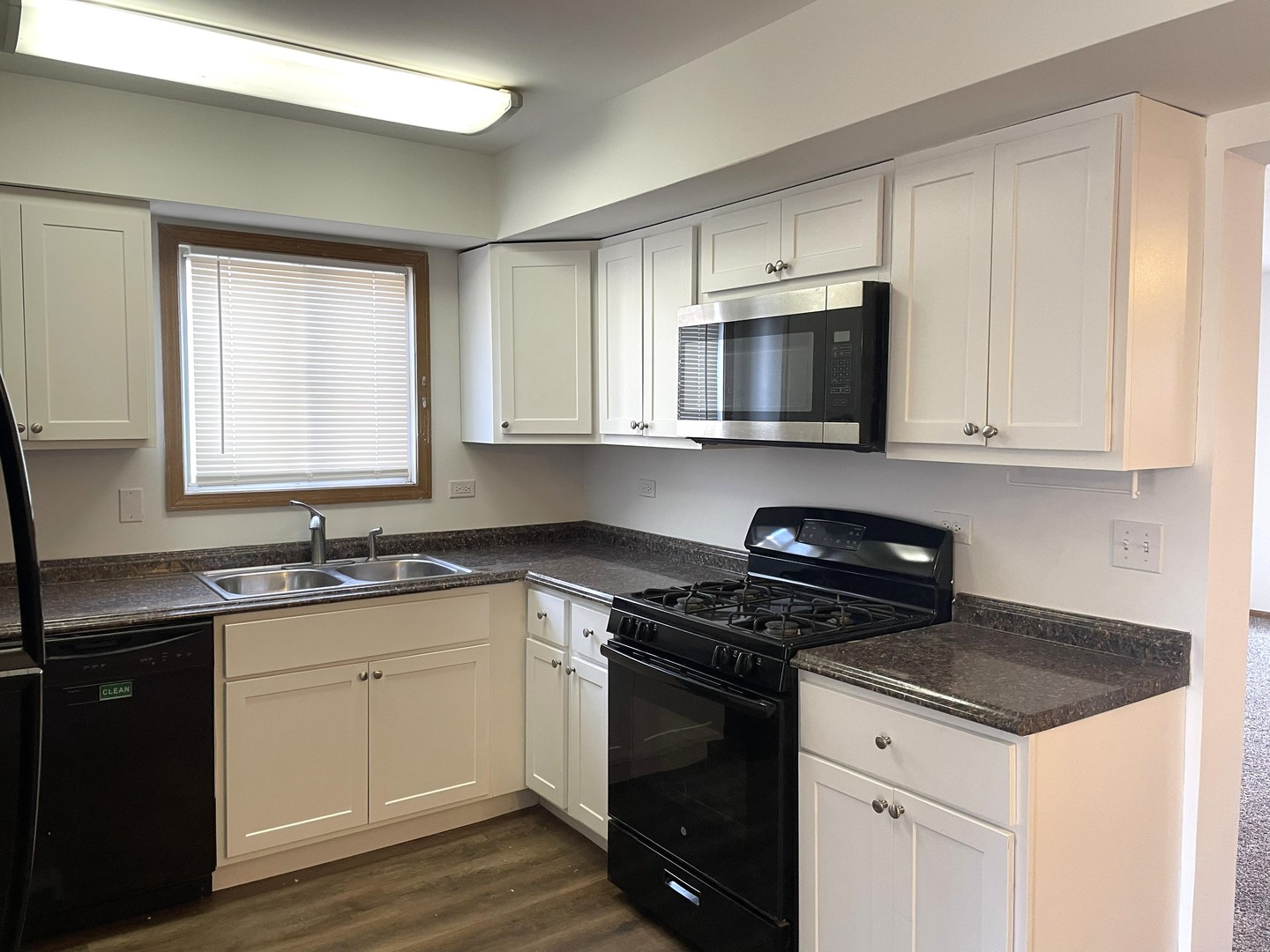 1740 Cumberland Road Aurora, IL 60504 - Photo 8 of 37 a kitchen with granite countertop a sink cabinets and stainless steel appliances
