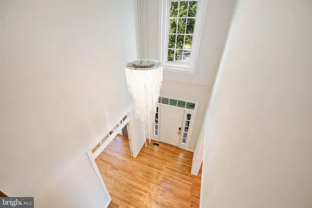 a bathroom with a large tub a sink a window and a shower