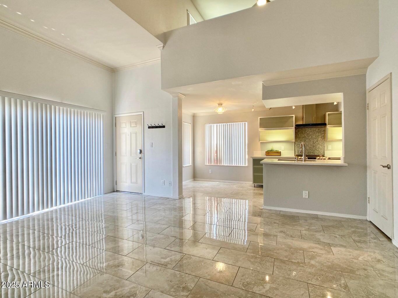 a view of a kitchen with a sink and a cabinet