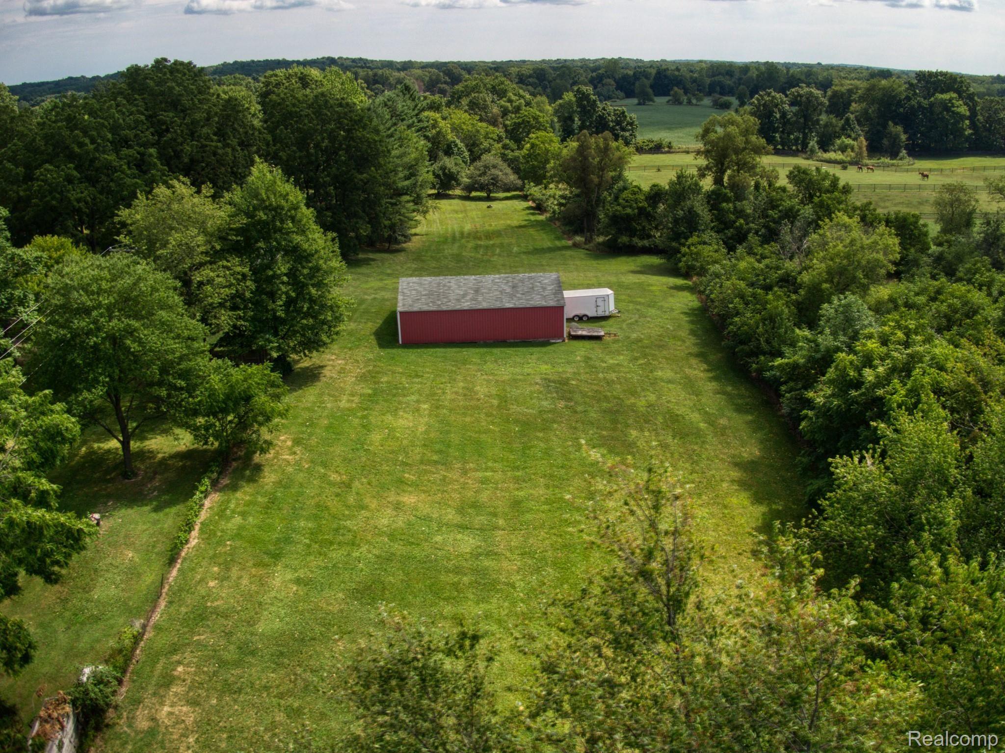 4065 Jewell Road Howell, MI 48843 - Photo 56 of 62 SURROUNDED BY TREES...BEAUTIFUL