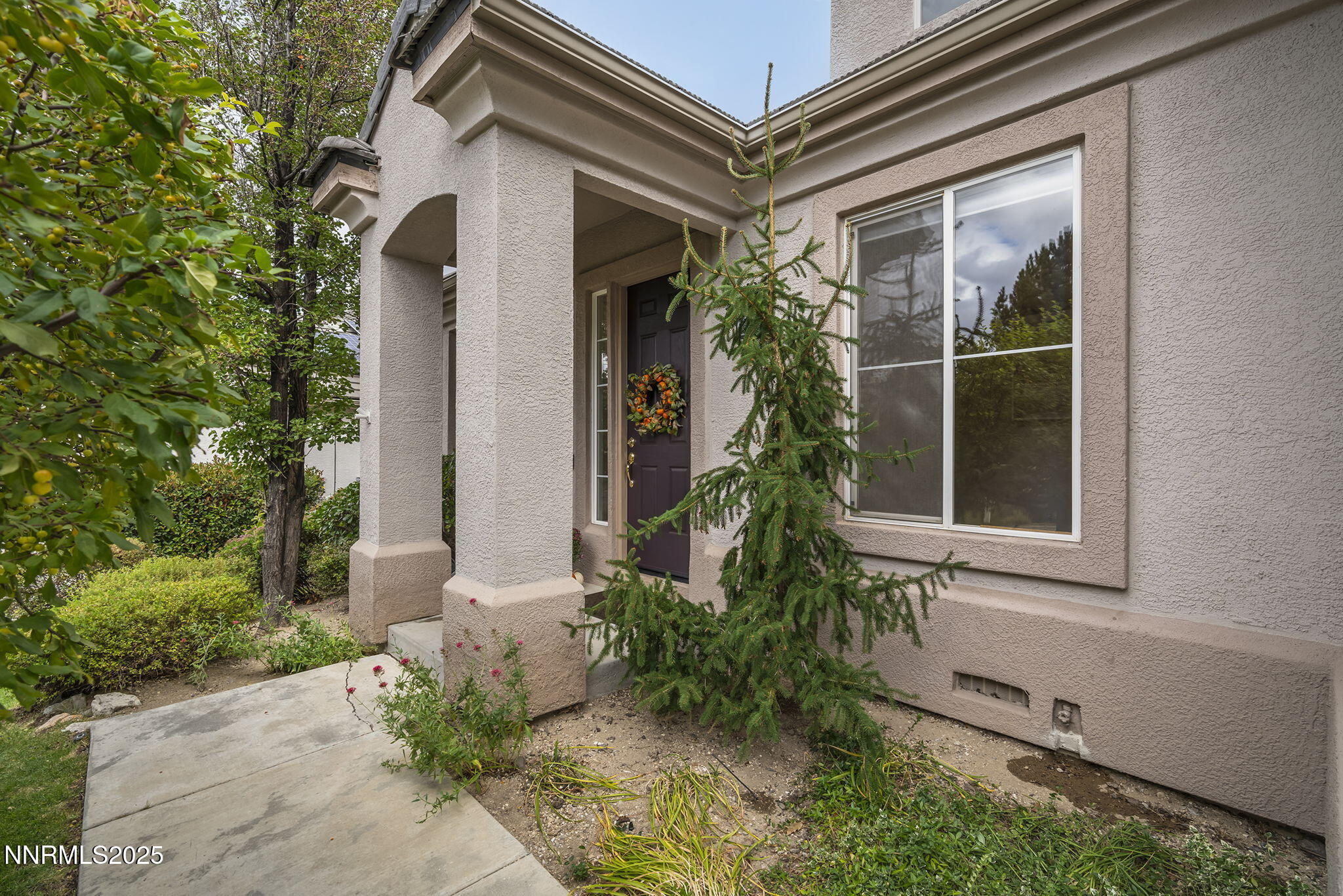 1720 Hunter Creek Road Reno, NV 89519 - Photo 1 of 21 a front view of a house with a yard