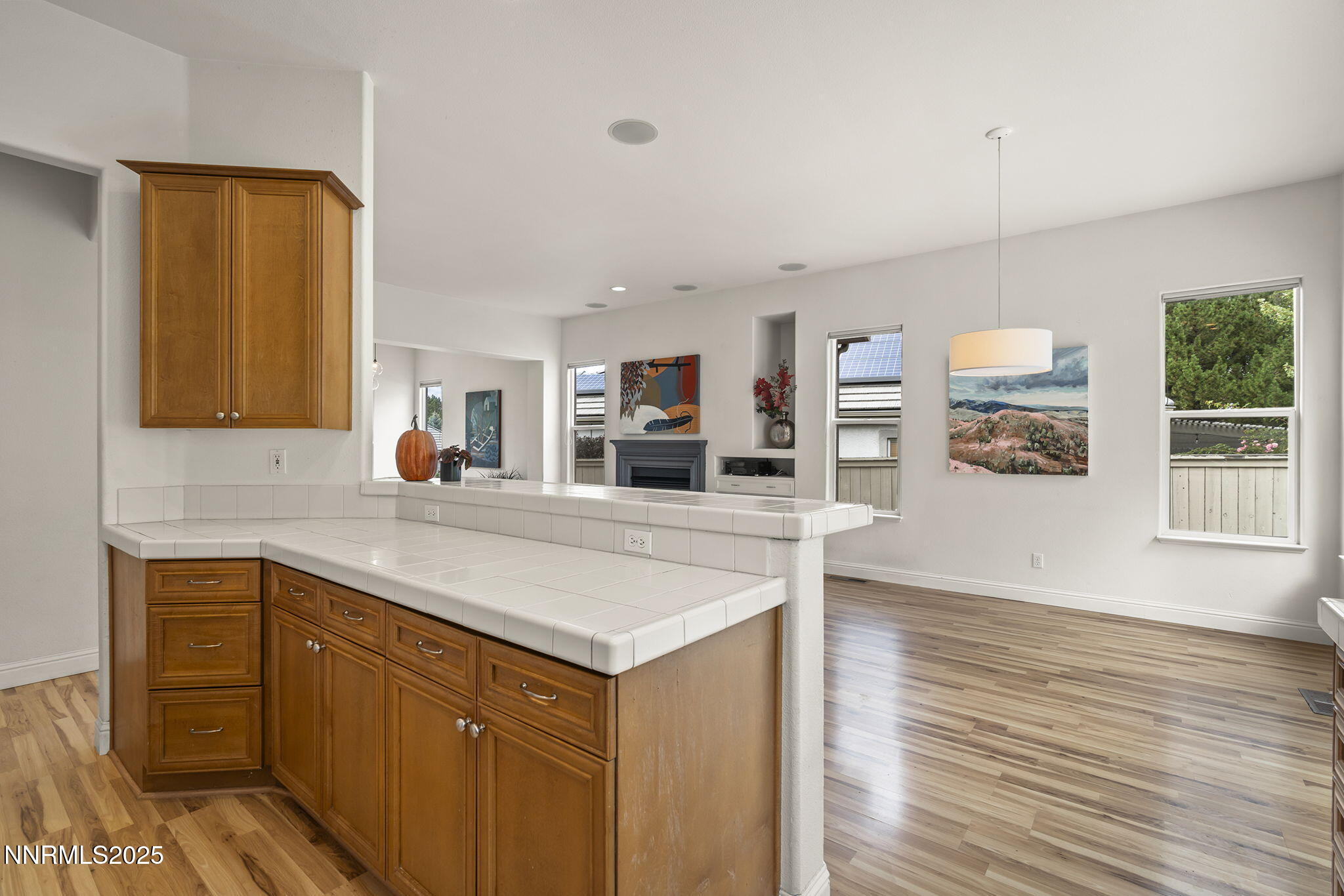 1720 Hunter Creek Road Reno, NV 89519 - Photo 11 of 21 a kitchen with stainless steel appliances granite countertop a sink and dishwasher with wooden floor