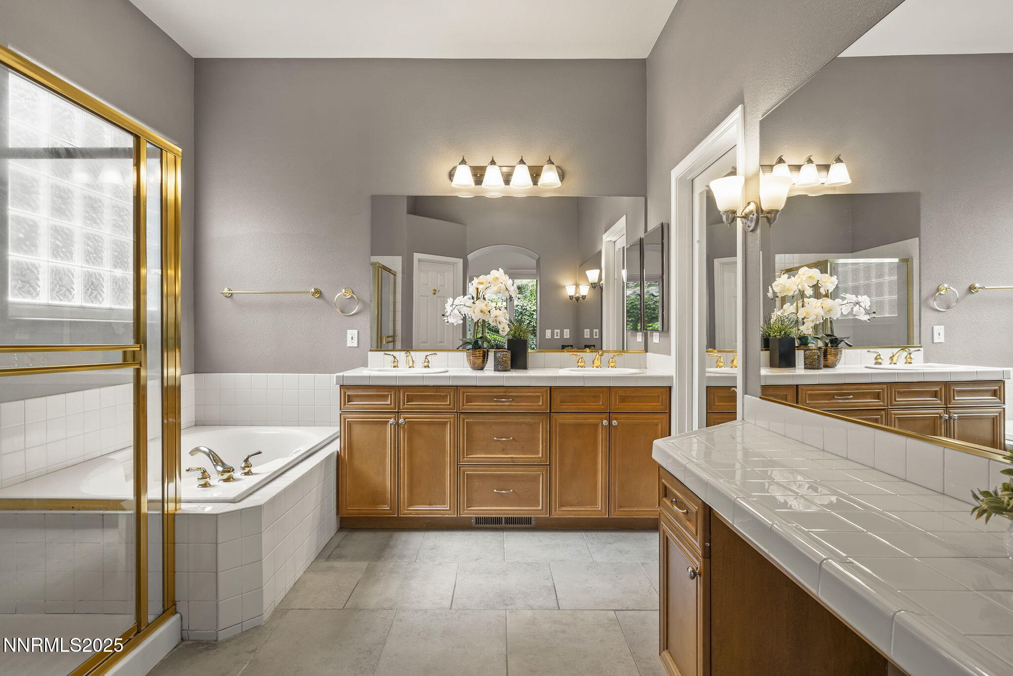 1720 Hunter Creek Road Reno, NV 89519 - Photo 13 of 21 a large spacious bathroom with a granite countertop tub a sink and a large mirror