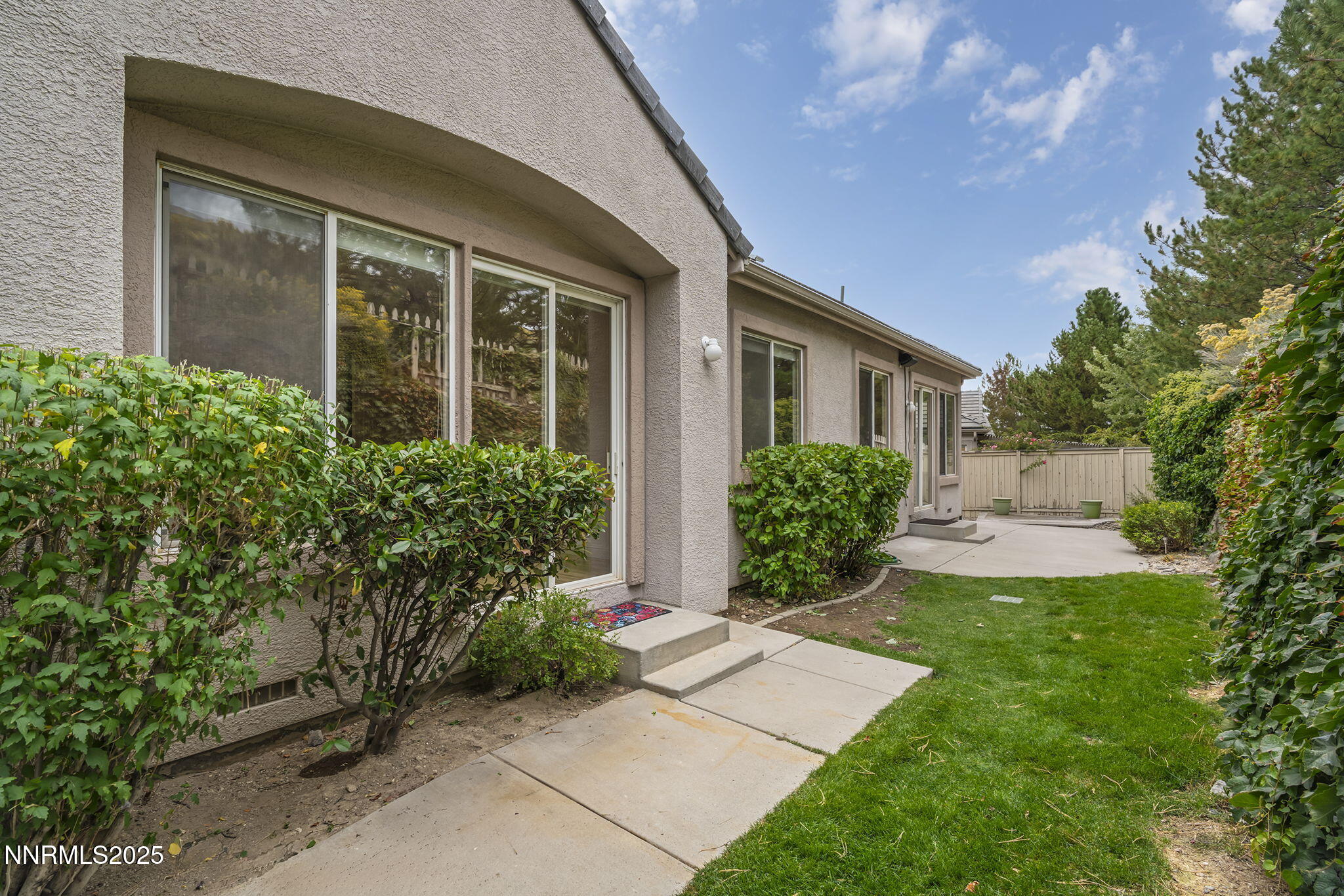 1720 Hunter Creek Road Reno, NV 89519 - Photo 19 of 21 a view of a house with a yard and plants