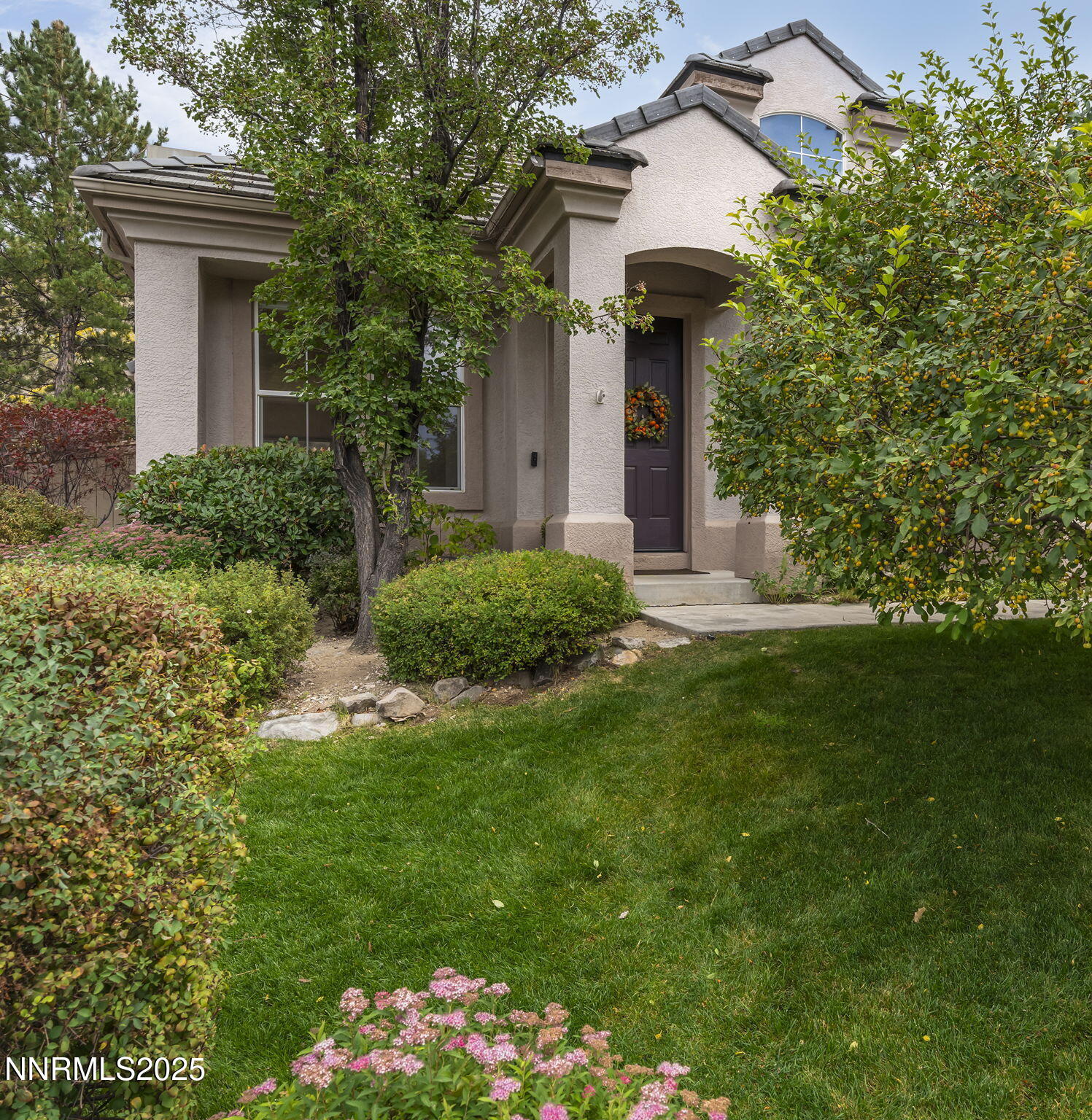 1720 Hunter Creek Road Reno, NV 89519 - Photo 20 of 21 a front view of a house with a yard