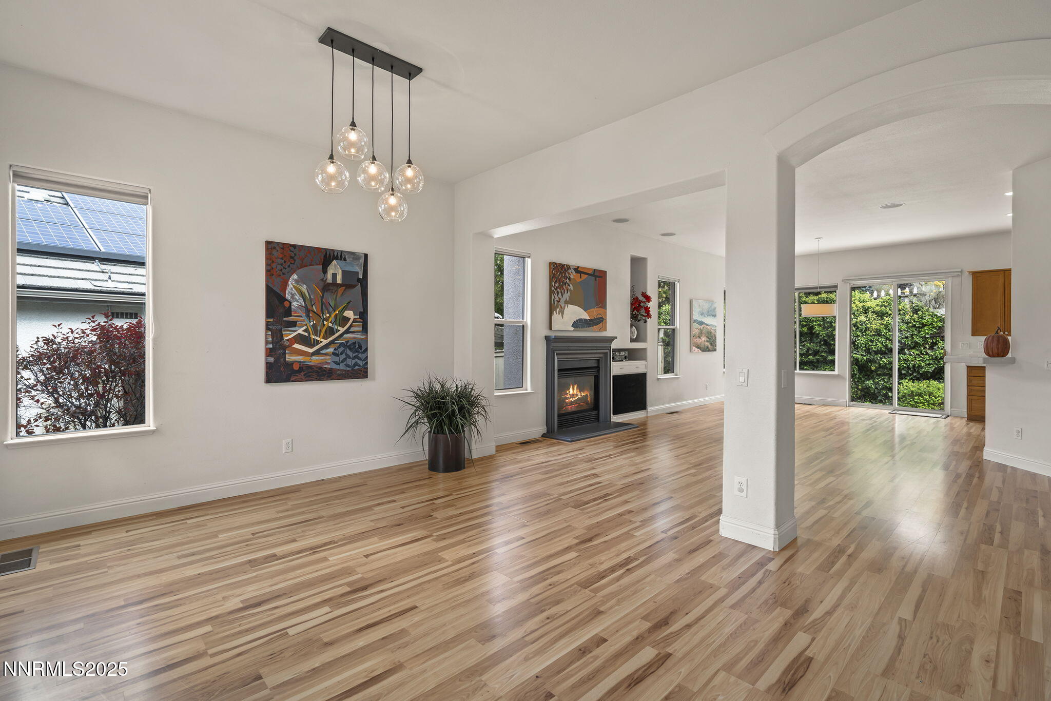 1720 Hunter Creek Road Reno, NV 89519 - Photo 5 of 21 a view of an empty room with wooden floor and a window