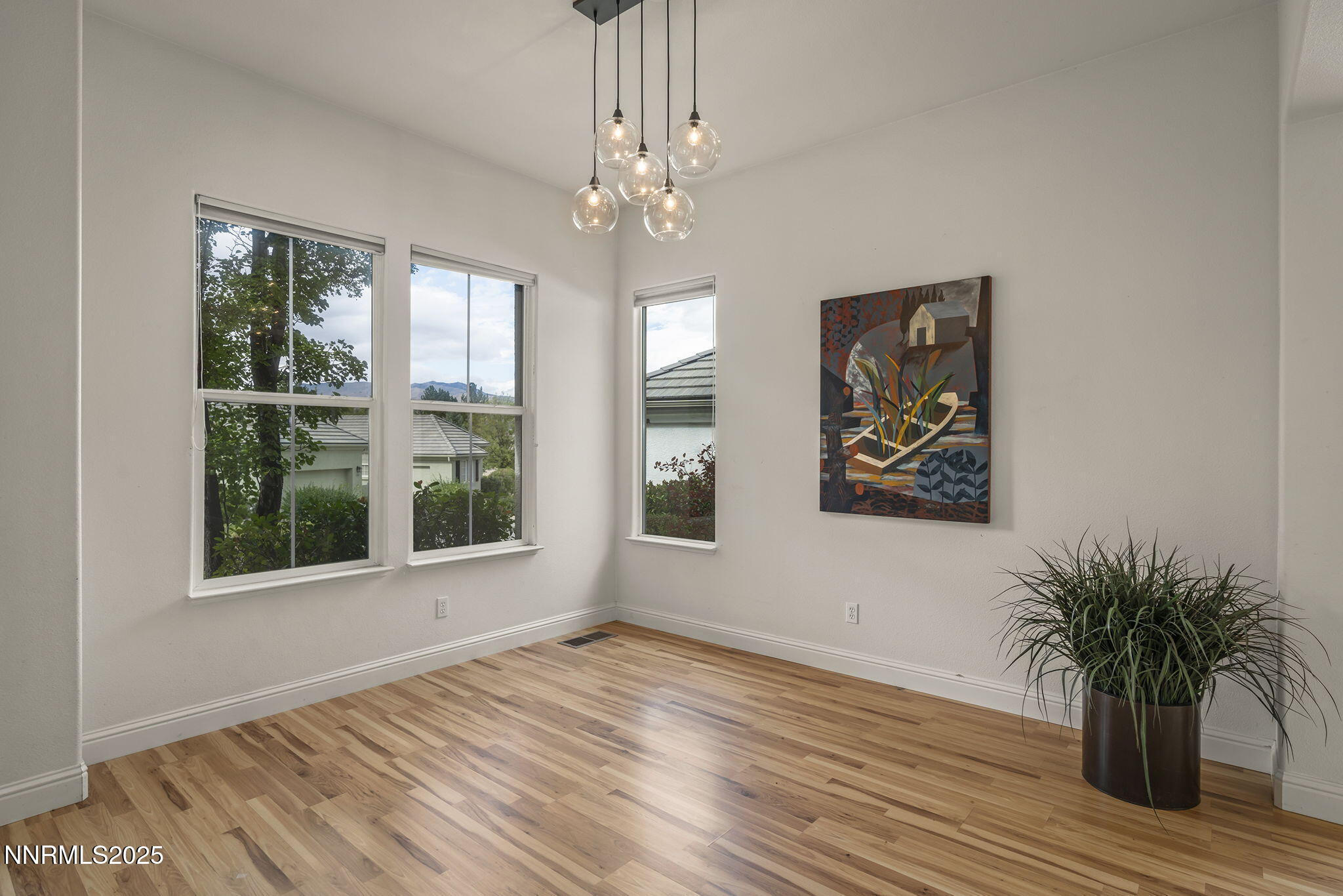 1720 Hunter Creek Road Reno, NV 89519 - Photo 6 of 21 a view of an empty room with wooden floor and a window