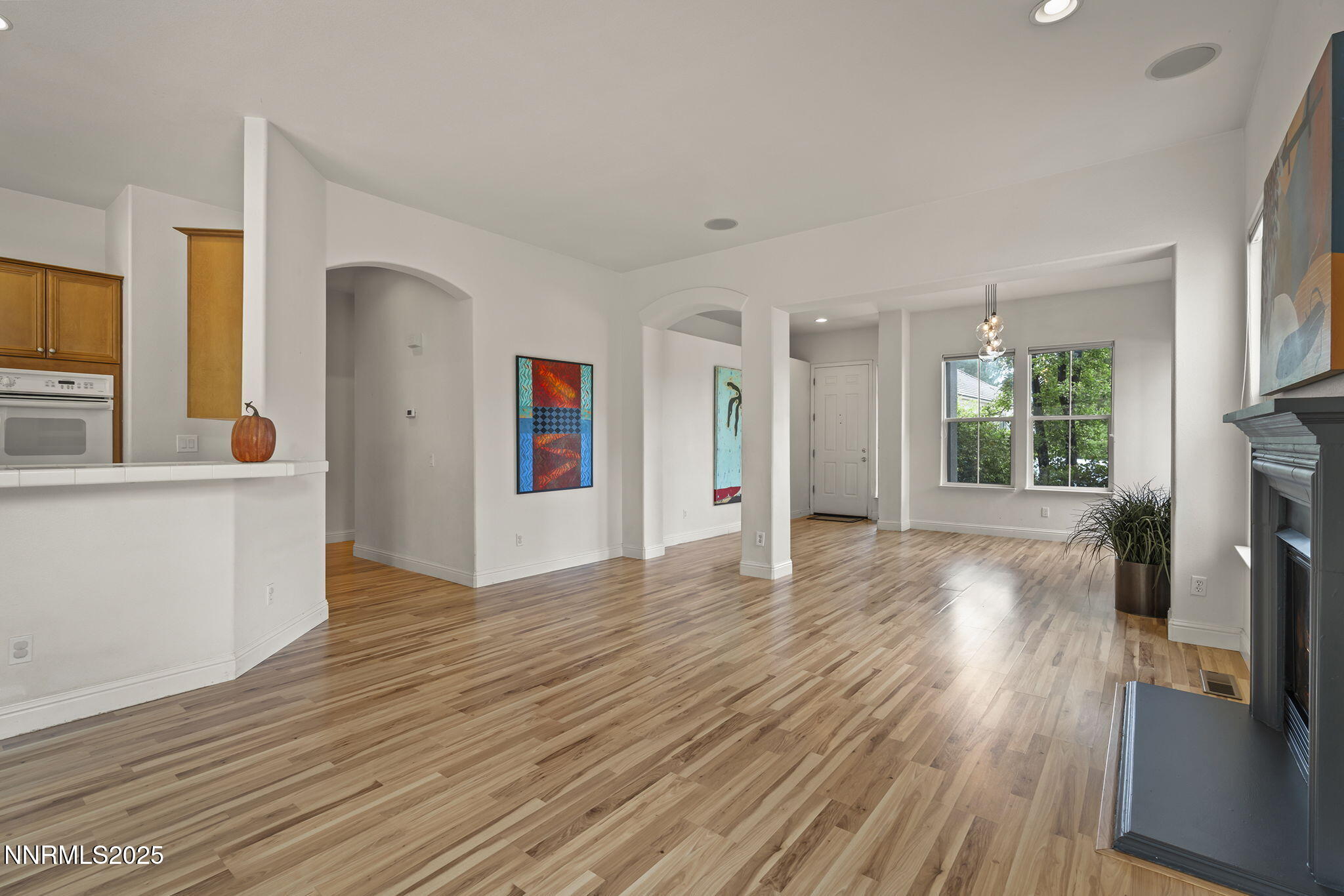 1720 Hunter Creek Road Reno, NV 89519 - Photo 7 of 21 a view of empty room with wooden floor and fan