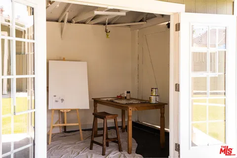 a dining room with a table and chairs