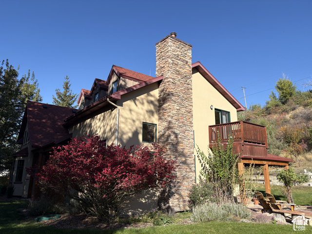725 Canyon Road Smithfield, UT 84335 - Photo 79 of 100 Stone-clad chimney extending above the roofline