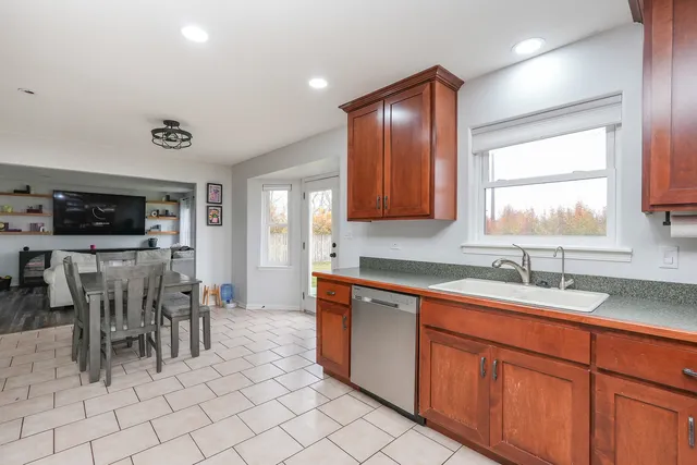 a kitchen with cabinets a sink and appliances