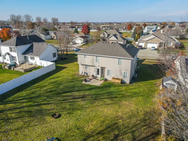 an aerial view of a house with outdoor space