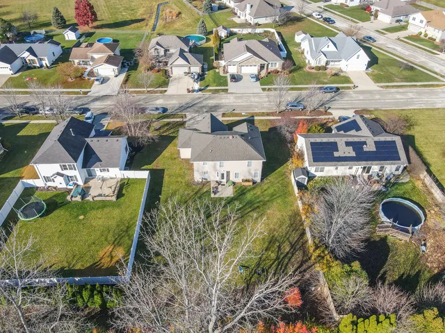 an aerial view of residential houses with outdoor space